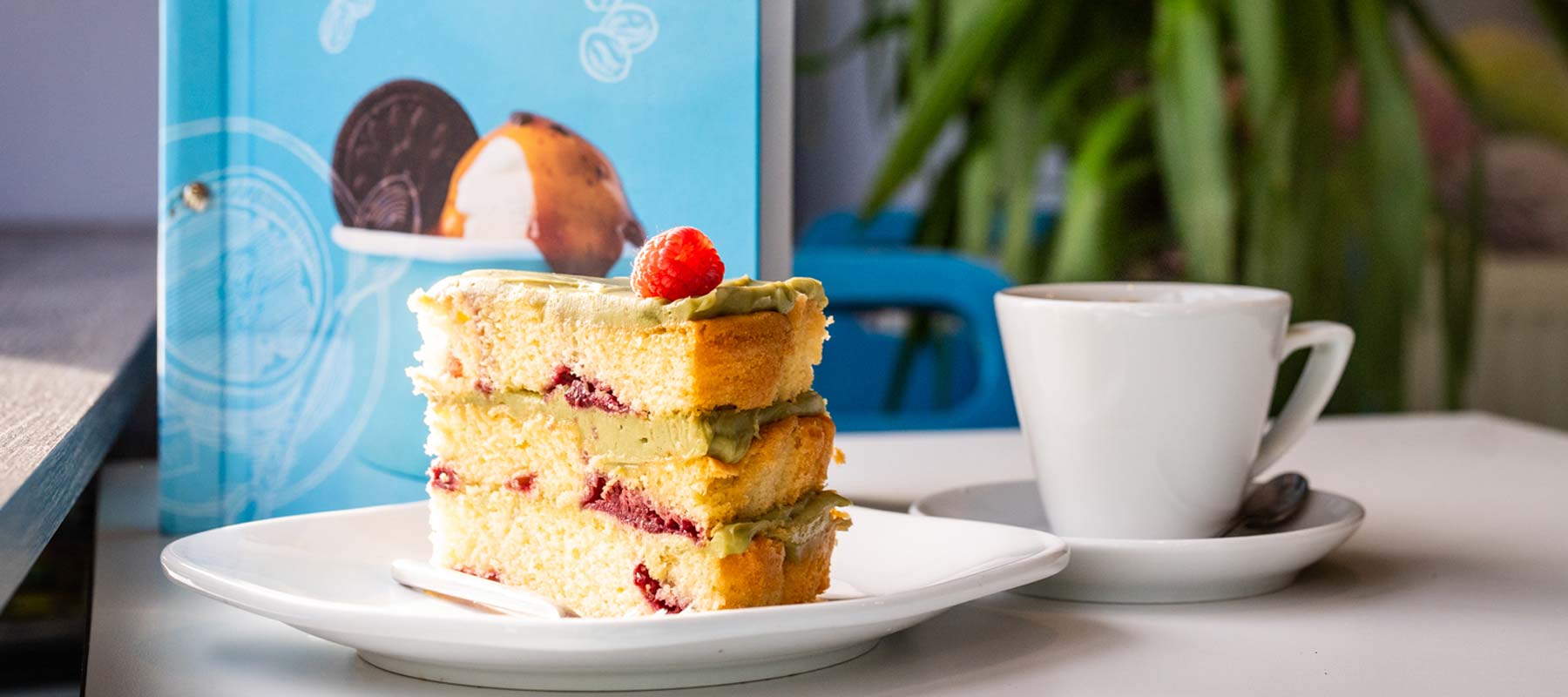 A slice of cake and a coffee